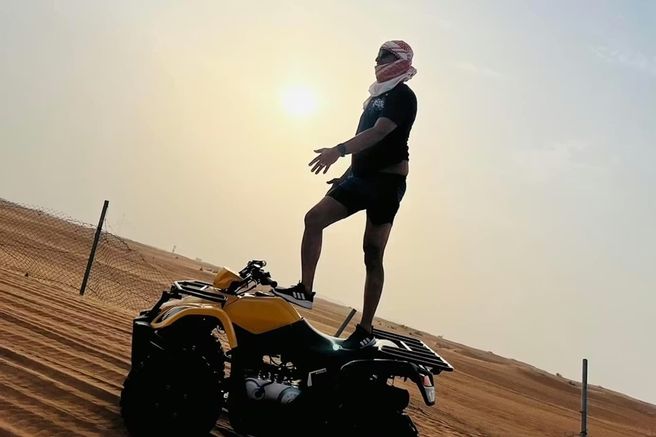 Dubai Sunset Desert Safari: Quad Biking, Sandboarding, Camel Ride & BBQ Dinner