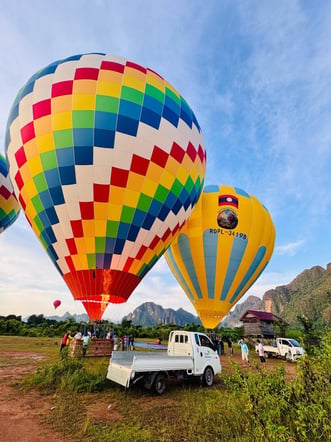 Vang Vieng Hot Air Balloon, Cave Tubing & Longtail Boat Half-Day Tour (Hotel Pickup)